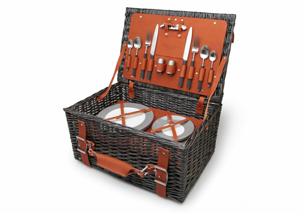 Fine dining can be taken to the great outdoors with this elegant picnic hamper from British luxury auto marque Aston Martin.