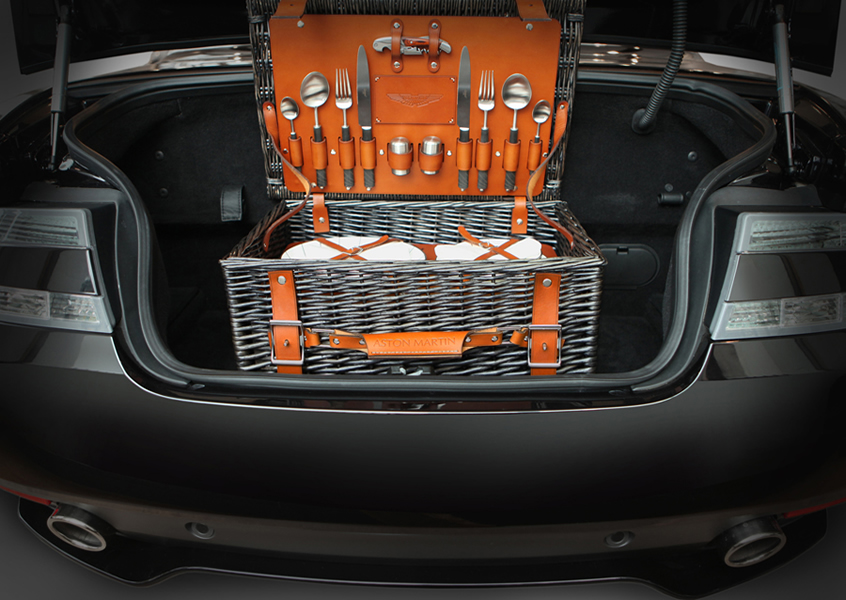 Fine dining can be taken to the great outdoors with this elegant picnic hamper from British luxury auto marque Aston Martin. 